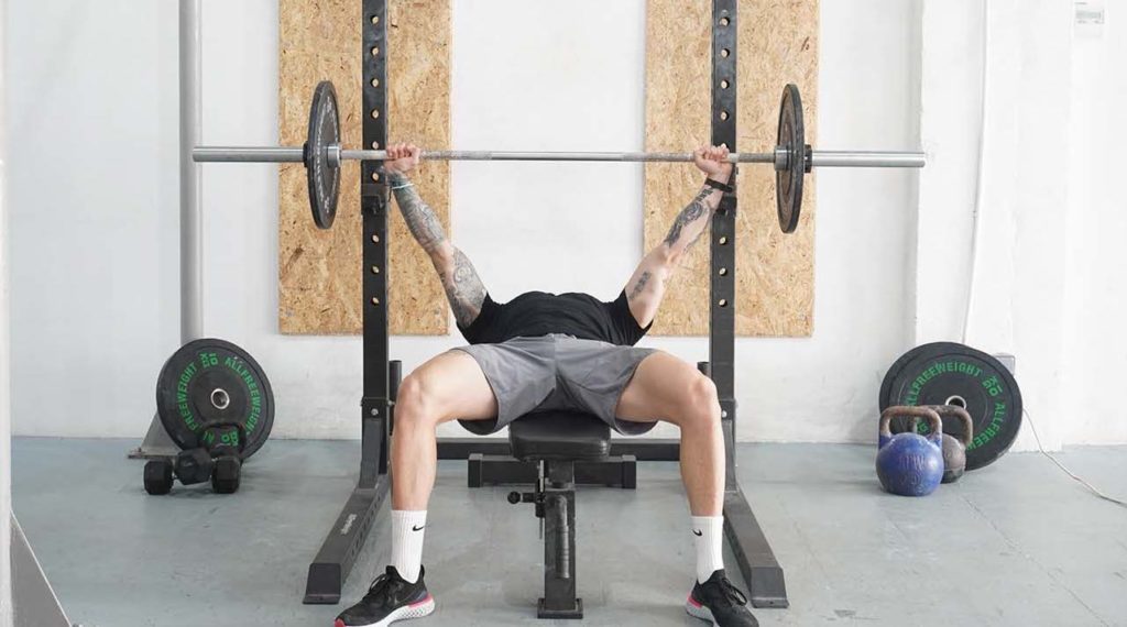 man wide grip bench press barbell